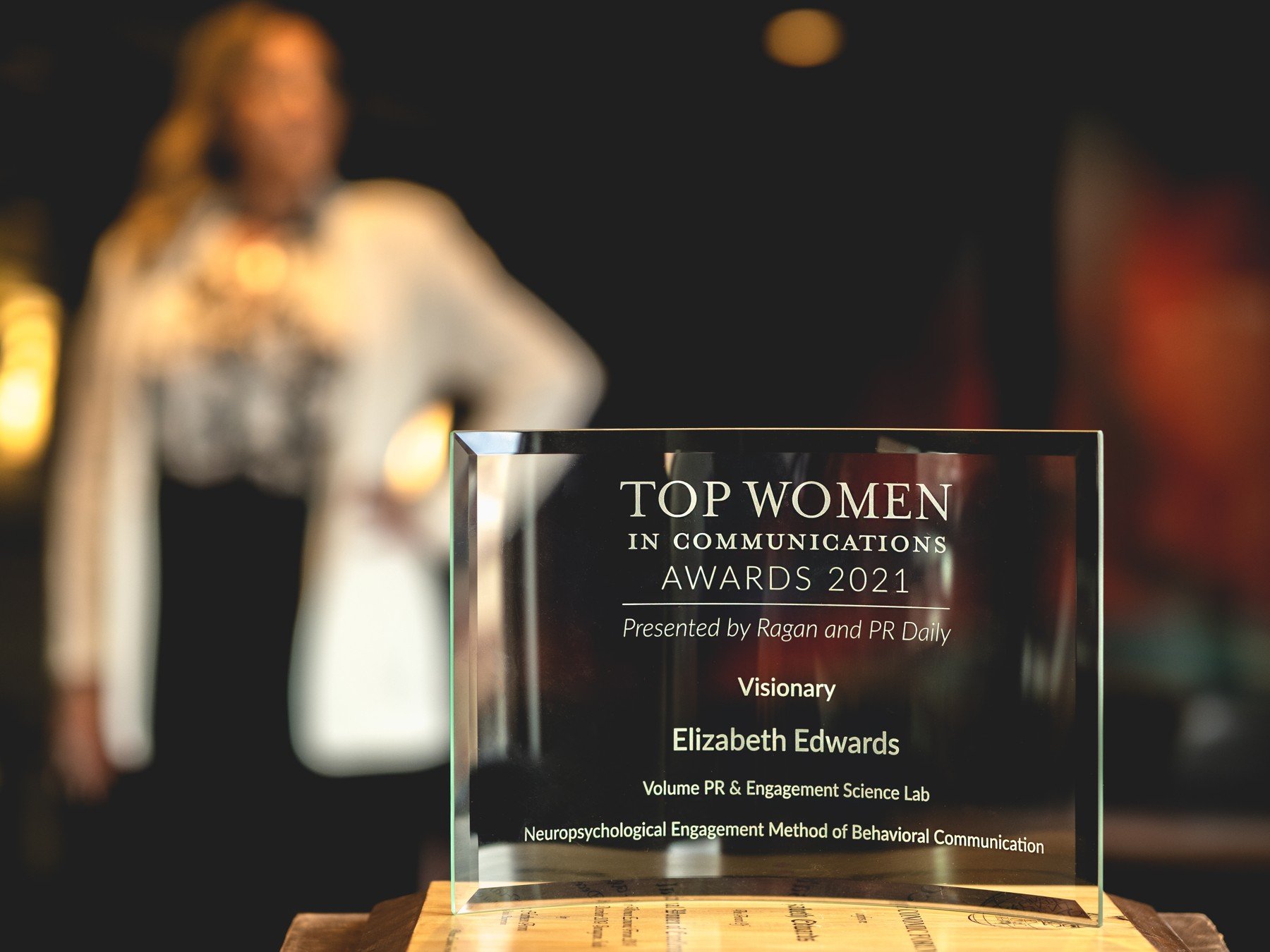 Ragan Top Women in Communications 2021 Visionary award presented to Elizabeth Edwards, with Edwards behind the award
