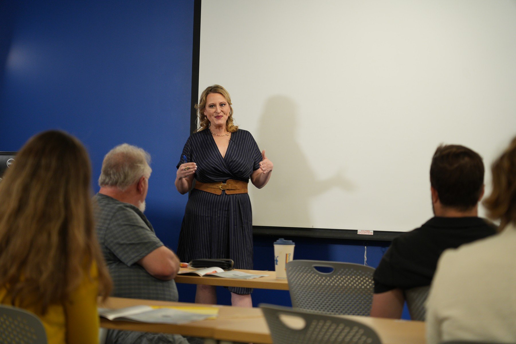 Elizabeth Edwards teaching communication with participants in the foreground