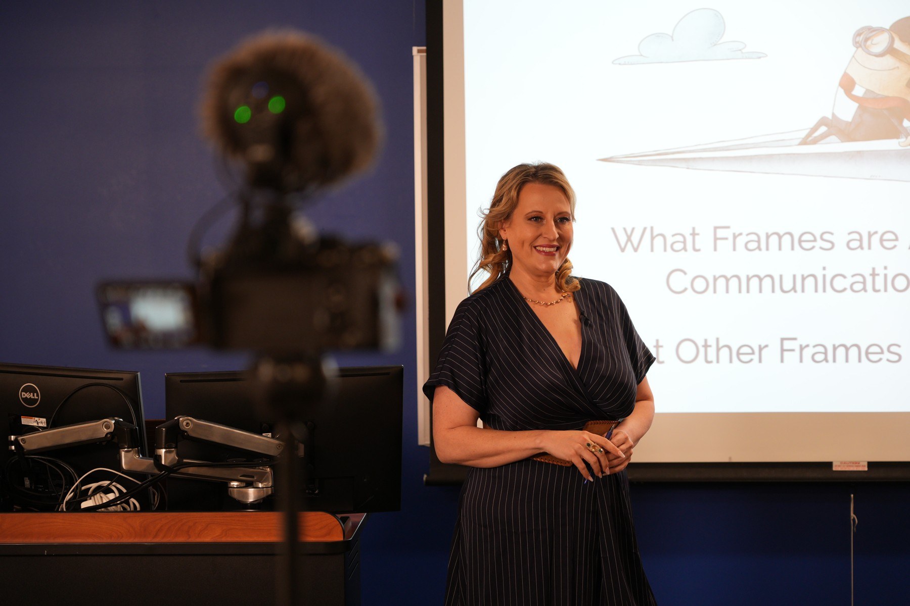 Elizabeth Edwards smiling while leading a communication workshop